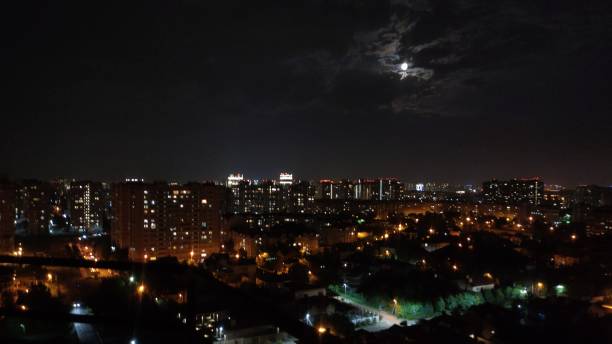 istock full moon night in the city 1414359218