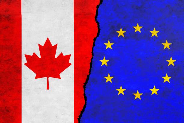 istock European Union and Canada painted flags on a wall with a crack. 1414363364