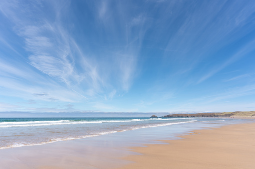 The sun shines down on sandy Perranporth Beach in Cornwall.