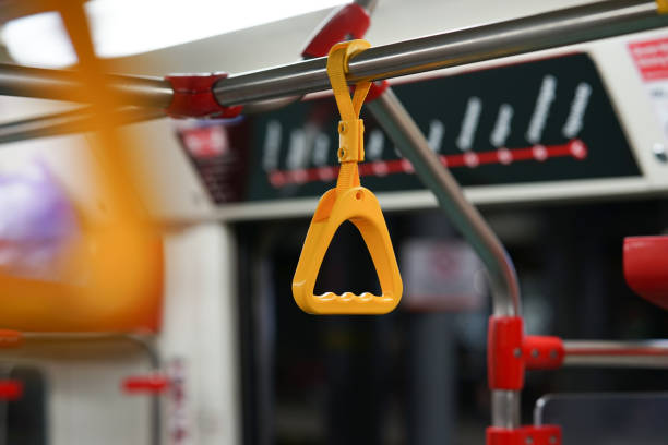 istock yellow hanging handle grip on public transportation such as bus and train 1414369166