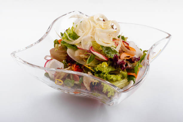 istock Radish salad in glass bowl isolated on white 1414369975
