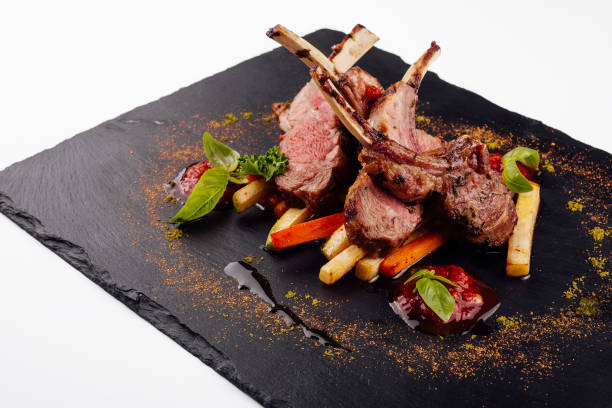 istock roasted lamb rack served with carrot, yellow curry and lamb sauce 1414370006