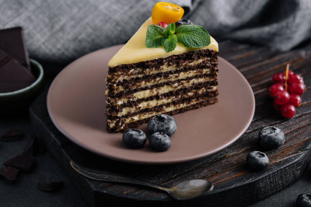 istock chocolate vanilla cake with berries on plate 1414371340