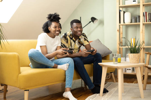 istock African American couple having fun playing video games 1414373874