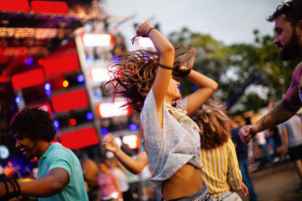 istock Friends dancing at a concert. 1414376853