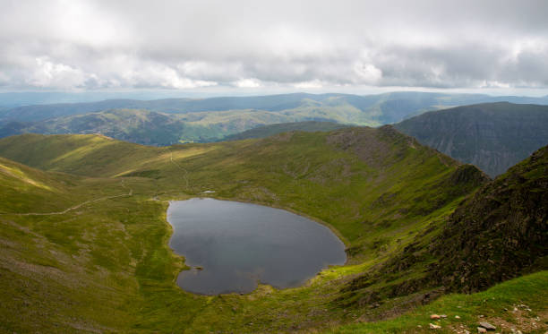 National Park Lake District, Helvellyn Hills, view while climbing Lake Thirlmere and Red Tarm, crossing Striding Edge and Swirral Edge during fog, 2022. National Park Lake District, Helvellyn Hills, view while climbing Lake Thirlmere and Red Tarm, crossing Striding Edge and Swirral Edge during fog, 2022. striding edge stock pictures, royalty-free photos & images