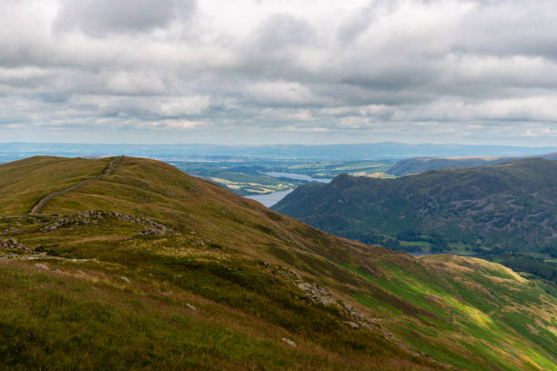 National Park Lake District, Helvellyn Hills, view while climbing Lake Thirlmere and Red Tarm, crossing Striding Edge and Swirral Edge during fog, 2022. National Park Lake District, Helvellyn Hills, view while climbing Lake Thirlmere and Red Tarm, crossing Striding Edge and Swirral Edge during fog, 2022. striding edge stock pictures, royalty-free photos & images