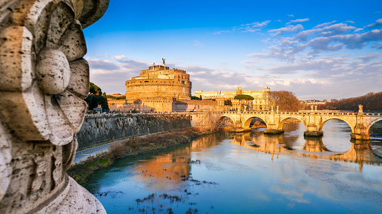 istock The golden hour in a suggestive cityscape along the banks of the river Tiber in the historic heart of Rome 1414378678