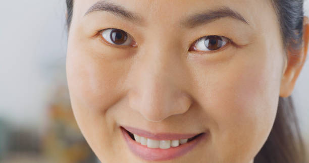 istock Smiling woman looking into camera 1414378694