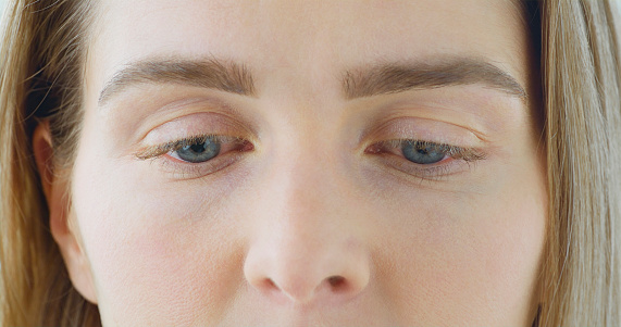 Female one green gray eye closeup. Laser vision correction concept