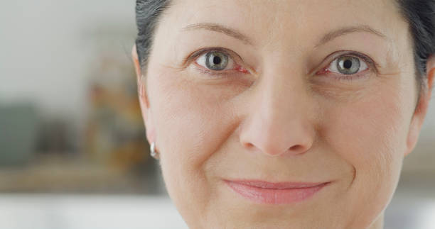 istock Smiling woman looking into camera 1414378768