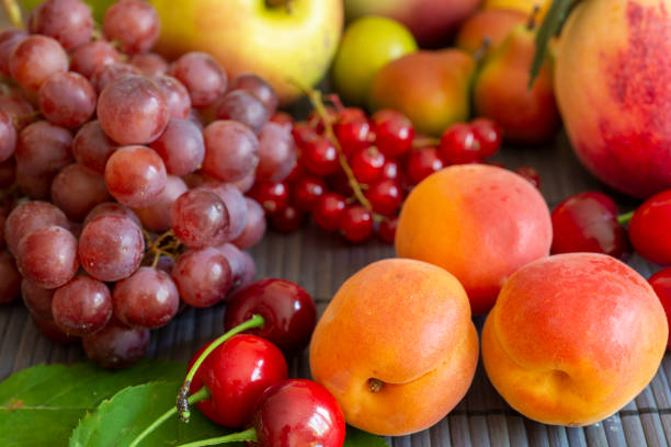 Summer fruits - apricot, peach, grapes, pear, cherries, currants
