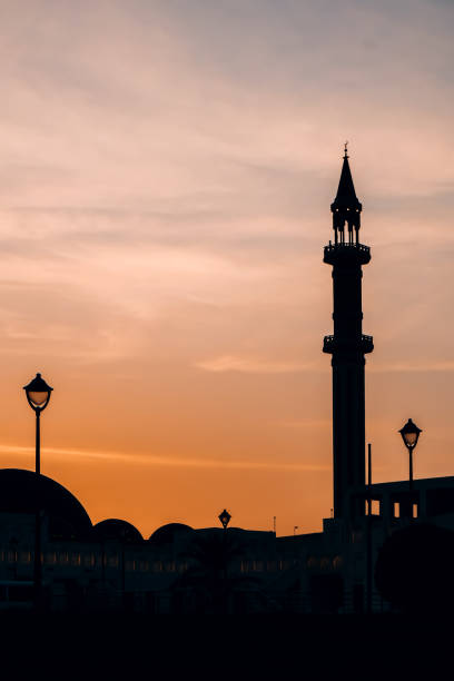 istock Silhouette of mosque on a sunset sky in Doha, Qatar 1414380895