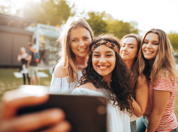 istock friends take a selfie in the park 1414381414