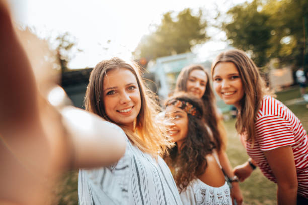 istock friends take a selfie in the park 1414382049