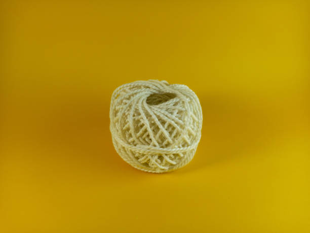 istock cotton rope for making crafts and for knitting on a yellow background 1414382080