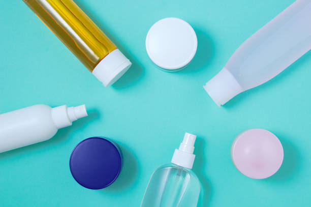 istock Lotion bottles face cream jars. Turquoise background. View from above. 1414382913