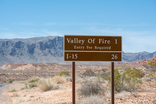 Valley Of Fire road sign seen a mile before entering the area. Seen in the desert a hot day in the summer.