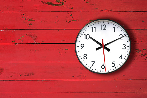 Old fashion clock on the red wooden wall, Plently copy space for your text.