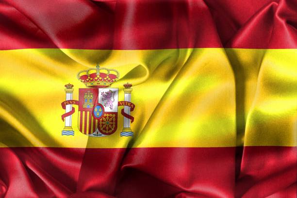 istock Spain flag - realistic waving fabric flag 1414393919