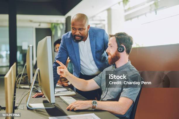 Training Manager Talking About Online Collaboration On Ux Or Ui Website Design With Information Technology Software Engineer Looking On Desktop Computer Business Men Discussing Online Data Together Stock Photo - Download Image Now