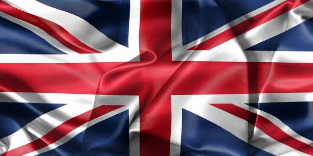 istock United Kingdom flag - realistic waving fabric flag 1414394232