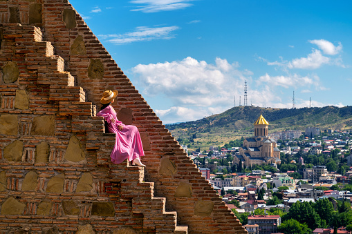 Woman enjoy view of Tbilisi from Narikala fortress, Georgia.