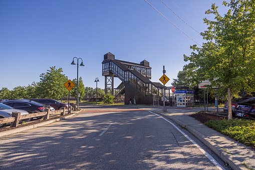 Beacon, Dutchess County, New York, NY, USA - July 3 2022: Railway station with a bridge over the tracks to the platform on the Metro-North line