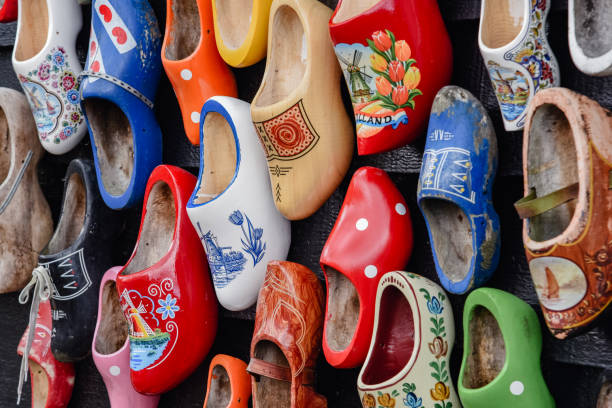 Wooden shoes painted with different regional motifs Wooden shoes painted with different regional motifs. Wooden clogs, typical traditional footwear from the Netherlands. zaanse schans stock pictures, royalty-free photos & images