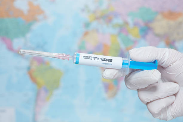 istock monkeypox vaccine syringe in front of map 1414399703