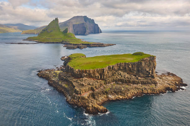 istock Faroe islands dramatic coastline viewed from helicopter. Vagar flight 1414400850