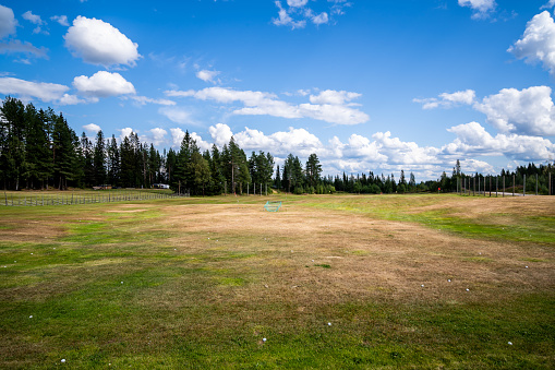 Summer landscape view of a driving range golf fairway for practice in Klövsjö Jämtland Sweden 2021.