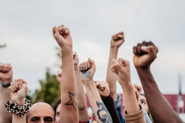 istock Protestors Raising Fists 1414401404