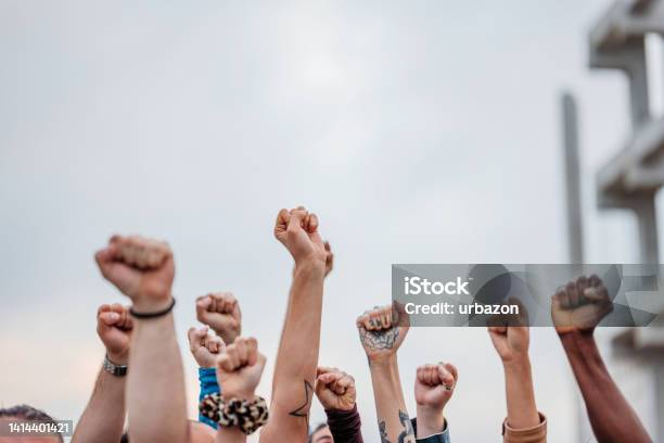 Protestors Raising Fists Stock Photo - Download Image Now - Protest, Student, Street