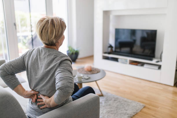 istock Elderly woman at home with back pain 1414402773