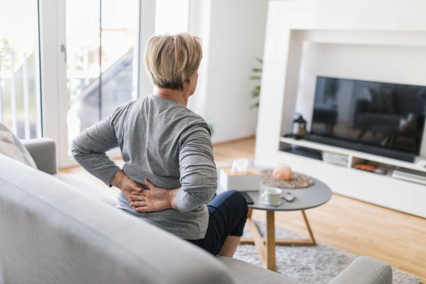 istock Elderly woman at home with back pain 1414402817