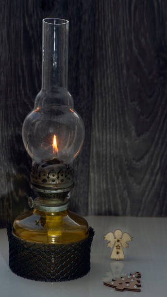 istock Kerosene lamp in the interior.Shadow pattern from the light of a kerosene lamp. 1414404125