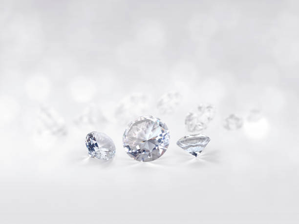 istock still with expensive cut diamonds in front of a white background, reflections on the ground. Lot of copyspace 1414404884
