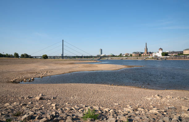 Düsseldorf, Germany - August 11, 2022: Low water of the Rhine river in Dusseldorf, drought in North Rhine Westphalia on August 11, 2022 in Germany