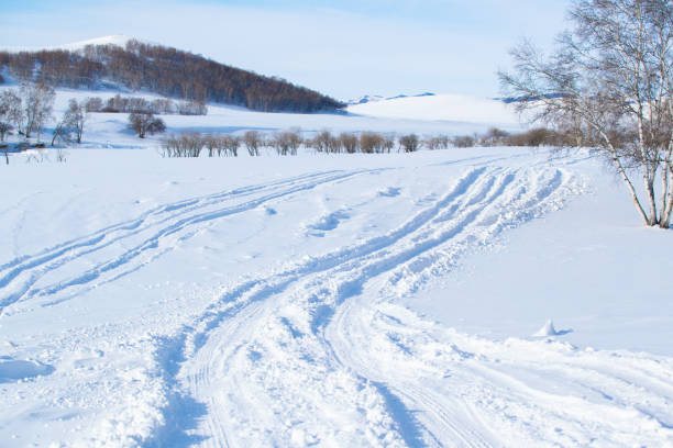Traces of the car on snow Snow-covered road,Car tire track street skid marks stock pictures, royalty-free photos & images