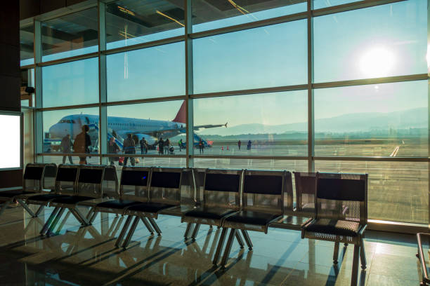 istock Airport waiting room, and plane 1414407854