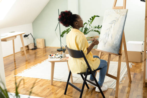 istock African female painter working on a new painting 1414409334