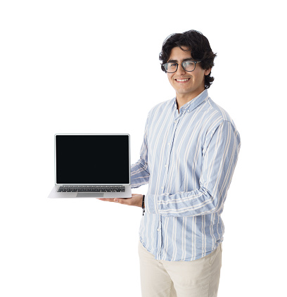Latin male student showing the screen of a laptop computer and looking at the camera.