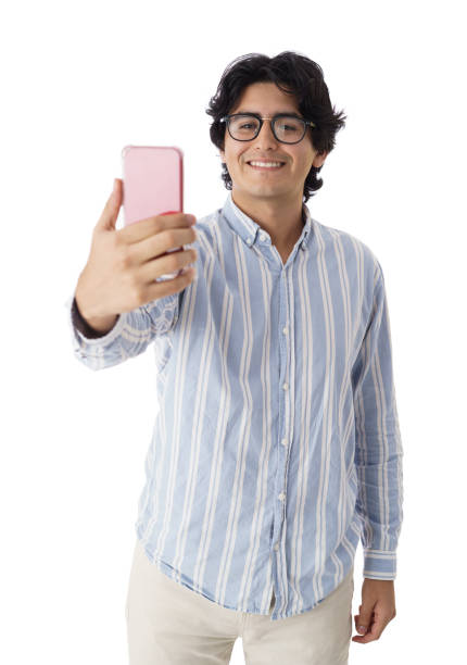 istock Young man holding phone and taking selfie with a smile 1414411293