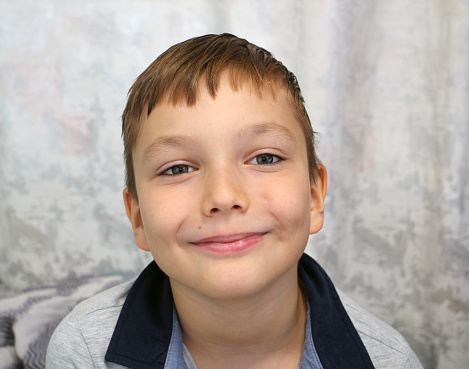 9 year old boy smiling. Close-up portrait.