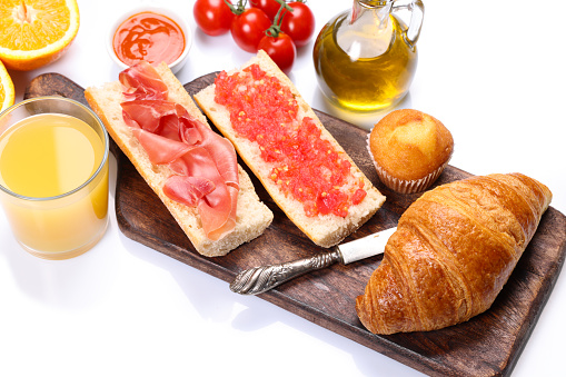 Spanish and Mediterranean Breakfast including Croissants Ham Tomato fresh juice