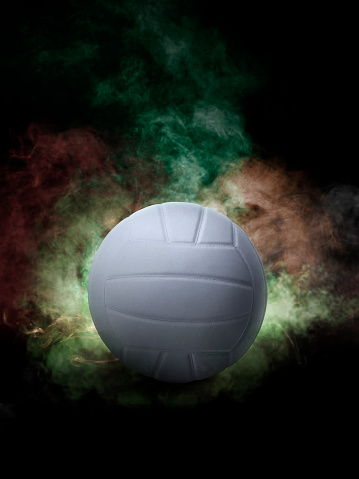 Volleyball on the color smoke background