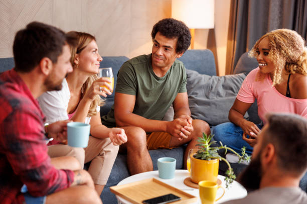 istock Friends drinking coffee and having fun at home 1414412610