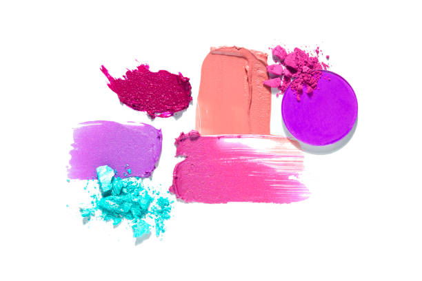 Creative concept fashion flatlay photo of cosmetics swatches beauty products lipstick eyeshadow cream foundation on white background.