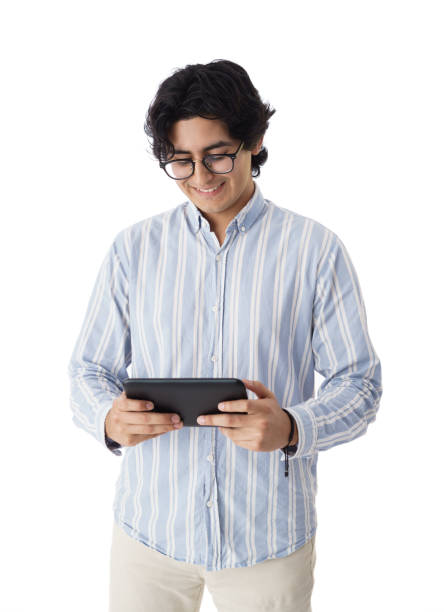 istock Young latin men standing and holding digital tablet 1414412910